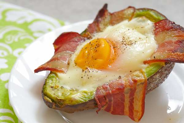 Avocado baked with cheese, egg and bacon